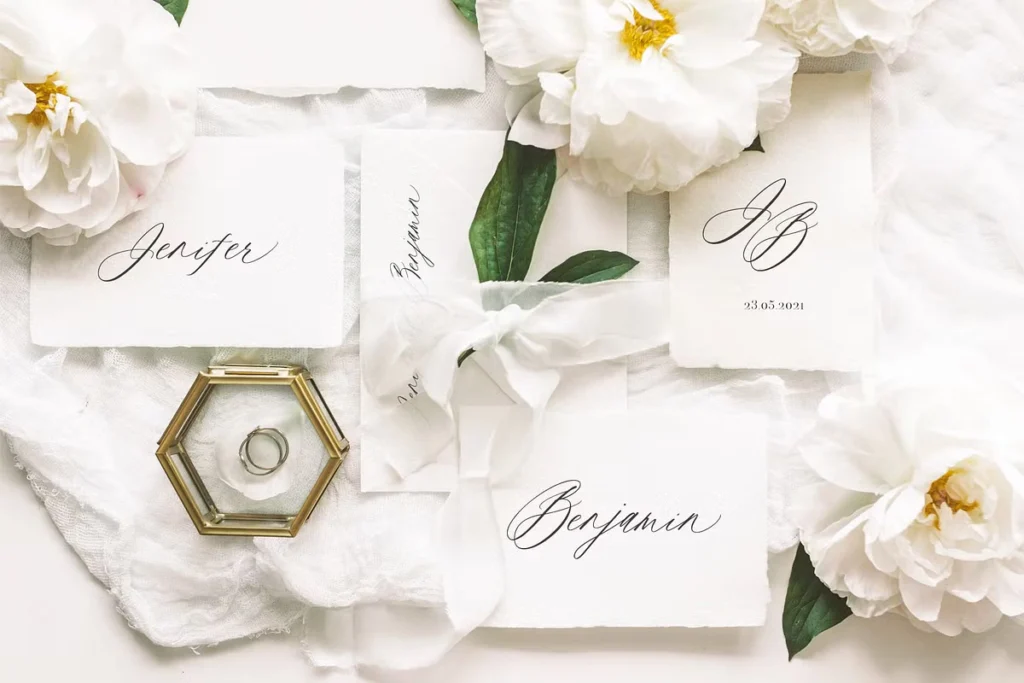 Place cards with Saint Viet Elegant Calligraphy Font in a floral wedding setting