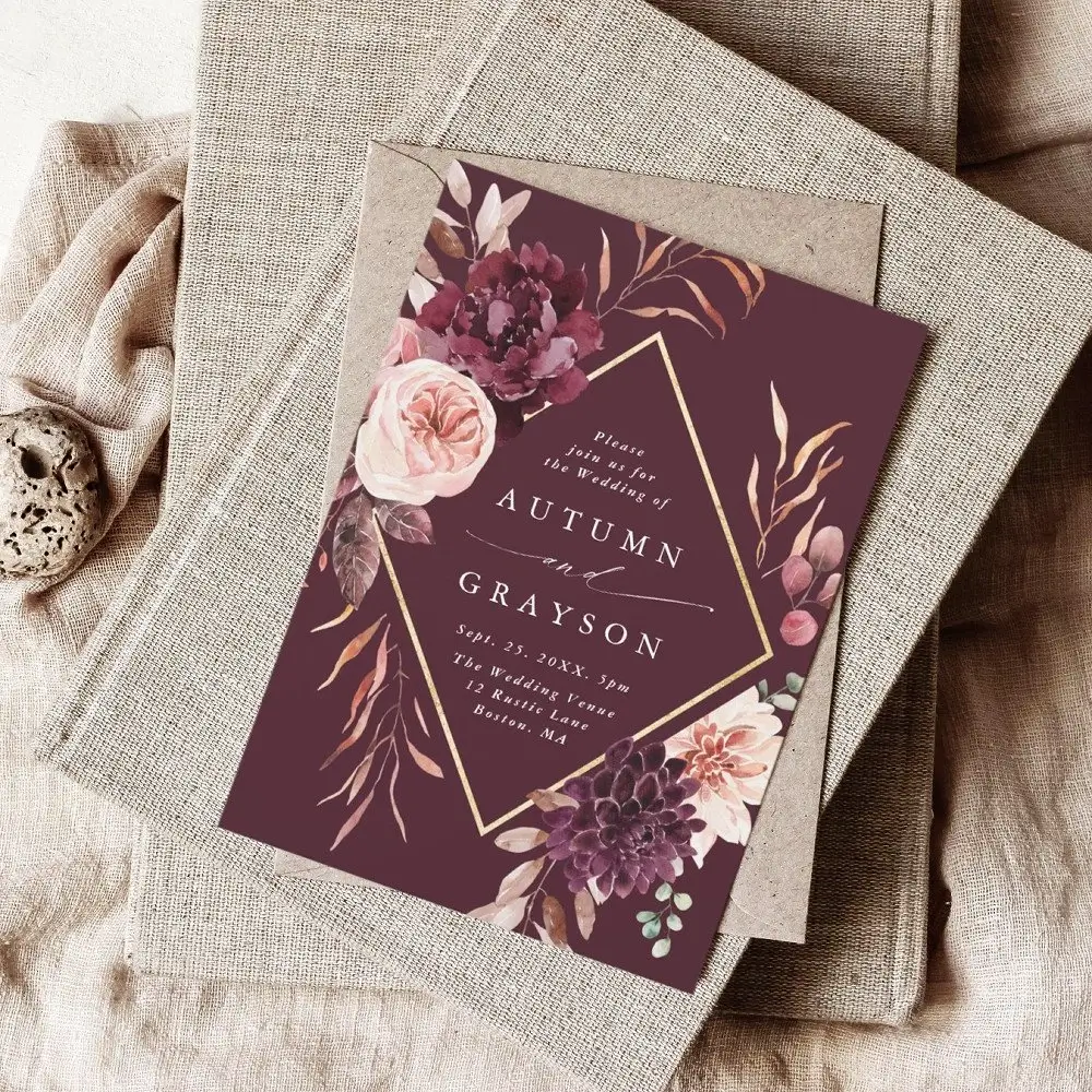 Elegant wedding invitation card with gold frame and watercolor flowers